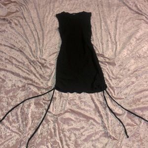 I am selling a medium length black tank dress. It has ties to make shorter!